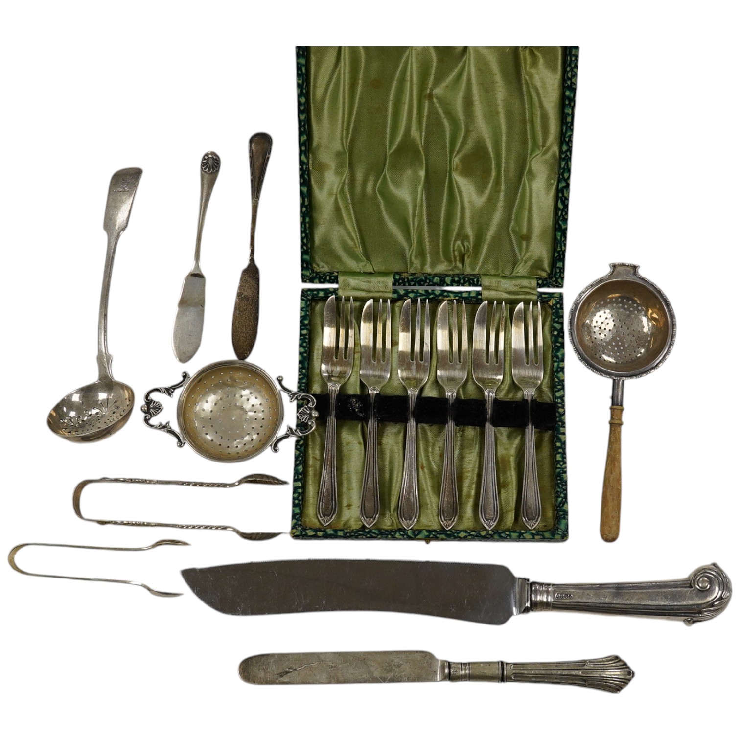 Sundry silver including cake forks, sifter ladle, salt spoons, Victorian silver handled bread knife, etc. Condition - poor to fair